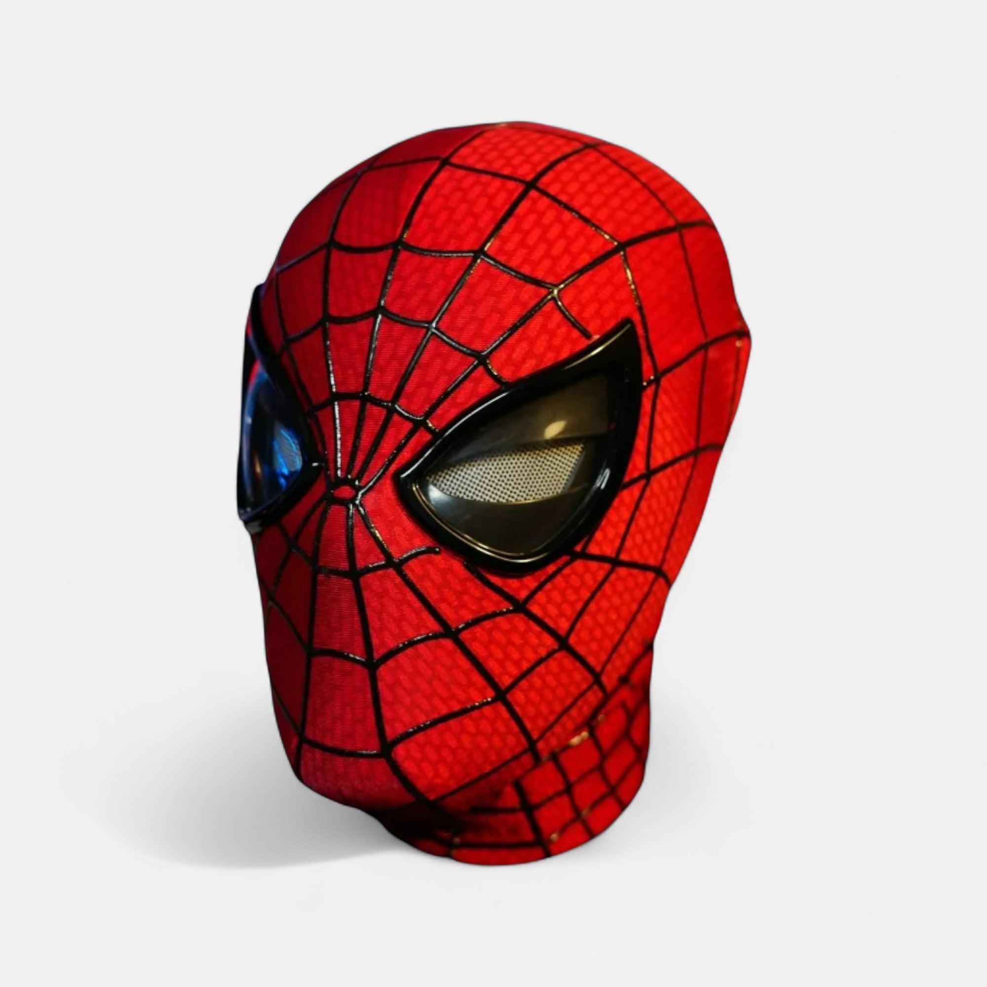 The Amazing Spiderman Mask with Blinking Movable Eyes Remote Controlled and LED Lights Side View. Spiderman mask with plain white background